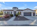 One-story home with a circular turret and a two-car garage at 4712 S Onyx Dr, Chandler, AZ 85249