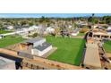 Aerial view showing a large property with a barn and lush greenery at 5301 E Emile Zola Ave, Scottsdale, AZ 85254