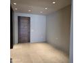 Spacious, light-filled room with neutral walls, tile flooring and ample electrical outlets at 6587 N Palmeraie Blvd # 2022, Paradise Valley, AZ 85253