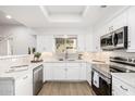 Modern white kitchen with stainless appliances at 8829 S 51St St # 3, Phoenix, AZ 85044