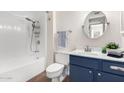 Updated bathroom with blue vanity and new fixtures at 10012 W Sandstone Dr, Sun City, AZ 85351