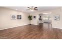 Bright living room with hardwood floors and ceiling fan at 10012 W Sandstone Dr, Sun City, AZ 85351