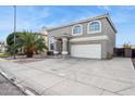 Two-story house with a two-car garage and palm tree landscaping at 11025 W Lane Ave, Glendale, AZ 85307