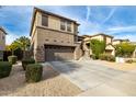 Two-story house with attached garage and landscaping at 1270 E Marcella Ln, Gilbert, AZ 85295