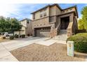 Two-story house with attached garage and landscaping at 1270 E Marcella Ln, Gilbert, AZ 85295