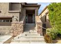 Front entrance with stone steps and railing at 1270 E Marcella Ln, Gilbert, AZ 85295