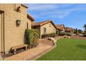 House exterior showcasing walkway, landscaping, and neighboring homes at 160 W La Vieve Ln, Tempe, AZ 85284