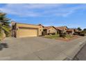 Tan stucco house with tile roof, two-car garage, and desert landscaping at 160 W La Vieve Ln, Tempe, AZ 85284