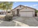 Single story home with neutral exterior and a two car garage at 16508 N 71St Ave, Peoria, AZ 85382