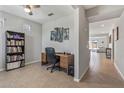 Home office features built-in desk and view to living area at 20138 W Madison St, Buckeye, AZ 85326