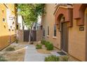 Private entry with walkway, landscaping, and gated access at 2150 W Alameda Rd # 1251, Phoenix, AZ 85085