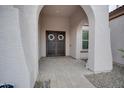 Front entry with arched walkway and double doors at 21556 S 215Th Pl, Queen Creek, AZ 85142