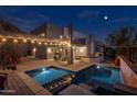 Expansive backyard oasis featuring a large pool and spa at 2208 E Belmont Ave, Phoenix, AZ 85020