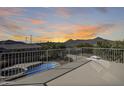 Elevated view of the backyard oasis with a pool and mountain backdrop at 24710 N 27Th Pl, Phoenix, AZ 85024