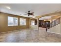 Open living area with tile flooring and a view of the kitchen at 24710 N 27Th Pl, Phoenix, AZ 85024