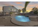 Inviting kidney-shaped pool with a spa and gazebo in the backyard at 24710 N 27Th Pl, Phoenix, AZ 85024