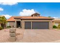 House exterior featuring a two-car garage at 25037 S Ribbonwood Dr, Sun Lakes, AZ 85248