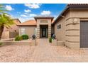 Front entry with walkway and landscaping at 25037 S Ribbonwood Dr, Sun Lakes, AZ 85248