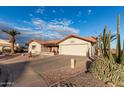 House exterior showcasing a driveway and mature desert plants at 2545 S Zinnia --, Mesa, AZ 85209