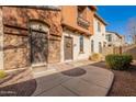 Townhome entry with stone accents and landscaping at 2727 N Price Rd # 22, Chandler, AZ 85224