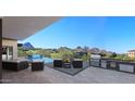 Outdoor oasis with a pool, built-in grill, and breathtaking mountain views at 29360 N 108Th Pl, Scottsdale, AZ 85262