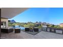 Outdoor oasis with a pool, built-in grill, and stunning mountain views at 29360 N 108Th Pl, Scottsdale, AZ 85262