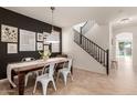 Modern dining room with a wooden table and gallery wall at 3675 E Parkview Dr, Gilbert, AZ 85295