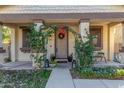 Inviting front entrance with an archway and lush greenery at 3675 E Parkview Dr, Gilbert, AZ 85295