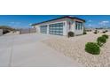 Attached two-car garage with modern glass doors at 39027 N 6Th Dr, Phoenix, AZ 85086