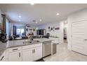 Open concept kitchen with granite countertops and stainless steel appliances at 4524 S 127Th Ln, Avondale, AZ 85323