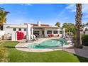 Inviting kidney shaped pool with grassy backyard at 5660 N 73Rd St, Scottsdale, AZ 85250