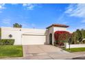 Single-story home with attached garage and manicured landscaping at 7354 E San Miguel Ave, Scottsdale, AZ 85250