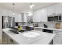 Modern kitchen with white cabinets, stainless steel appliances, and large island at 7756 E San Miguel Ave, Scottsdale, AZ 85250