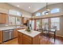 Modern kitchen with stainless steel appliances and an island at 8429 W Salter Dr, Peoria, AZ 85382