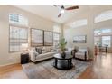 Light and airy living room with hardwood floors and neutral decor at 8429 W Salter Dr, Peoria, AZ 85382