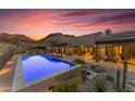 Relaxing pool area with a built-in barbecue at 8912 W Roberta Ln, Peoria, AZ 85383