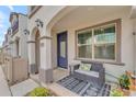 Inviting front porch with seating area and decorative rug at 9832 E Wavelength Ave, Mesa, AZ 85212