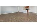 Living room with wood-look floors and kitchen at 17042 E Calle Del Oro -- # D, Fountain Hills, AZ 85268