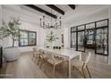 Modern farmhouse dining room with white table and wood accents at 20177 E Via De Arboles --, Queen Creek, AZ 85142