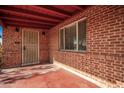 Brick front porch with a red ceiling and security door at 2326 E Yale St, Phoenix, AZ 85006