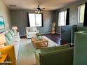 Cozy sitting area with a white sofa and wicker table at 4818 W Ellis St, Laveen, AZ 85339