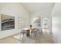 Elegant dining room with large artwork and view to kitchen at 9279 E Camino Del Santo --, Scottsdale, AZ 85260