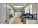 Bright kitchen with granite countertops and stainless steel appliances at 9909 W Newport Dr, Sun City, AZ 85351