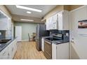 Kitchen features granite countertops and modern appliances at 9909 W Newport Dr, Sun City, AZ 85351