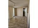 Casual dining area with tile flooring and access to a patio at 10546 W Catalina Dr, Arizona City, AZ 85123