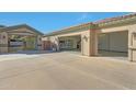 Spacious three-car garage with ample storage space and well-organized shelving units at 18009 W Denton Ave, Litchfield Park, AZ 85340