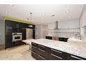 Spacious kitchen featuring granite countertops and stainless steel appliances at 18258 N 15Th Pl, Phoenix, AZ 85022