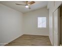 Bright bedroom with wood-look flooring and ceiling fan at 1918 W Colter St, Phoenix, AZ 85015