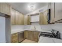 Updated kitchen featuring wood cabinets and quartz countertops at 1918 W Colter St, Phoenix, AZ 85015