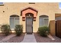 Townhome's front entrance with a security door and landscaping at 2250 E Deer Valley Rd # 77, Phoenix, AZ 85024